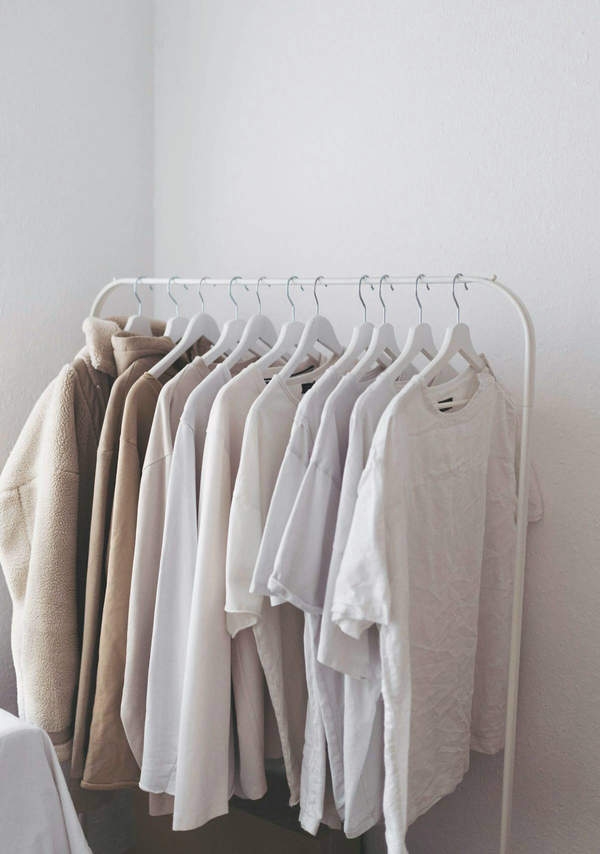 minimalist men outfit white t-shirt grey pants beige jacket